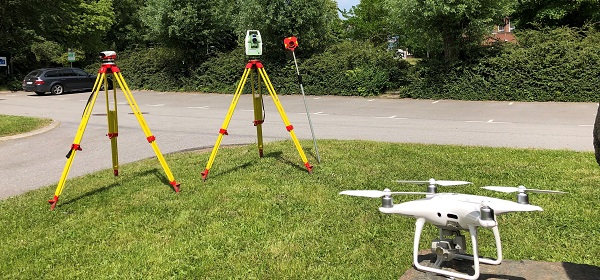 Geodetic surveying thematic photo featuring measurement instruments and a drone.
