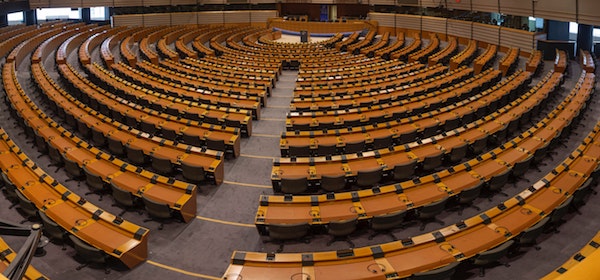 Policy and Governance thematic photo featuring a parliament hall.